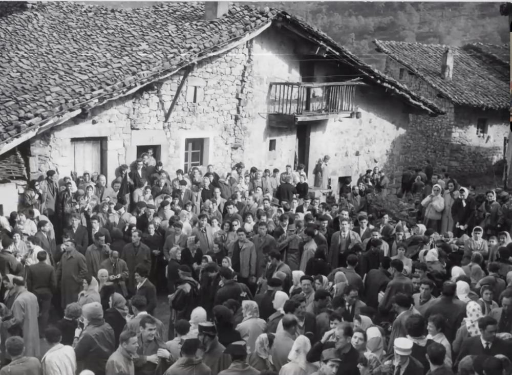 Historical photograph of the crowd in the village